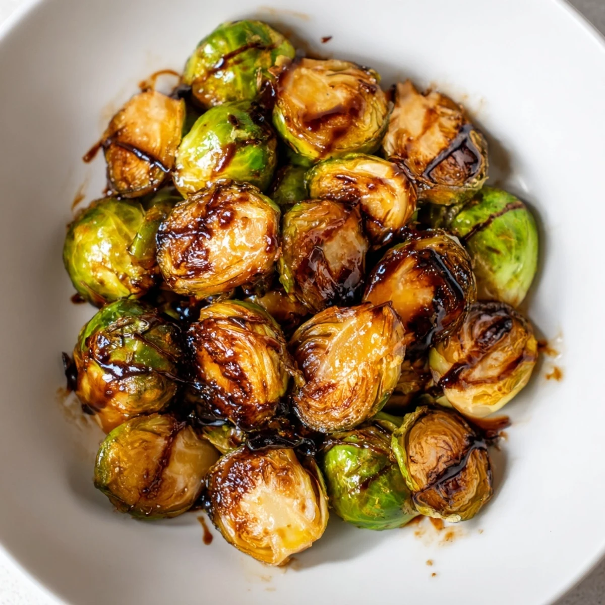 Golden, crispy Roasted Brussels Sprouts with Balsamic Glaze, a delicious and easy vegetarian side dish.