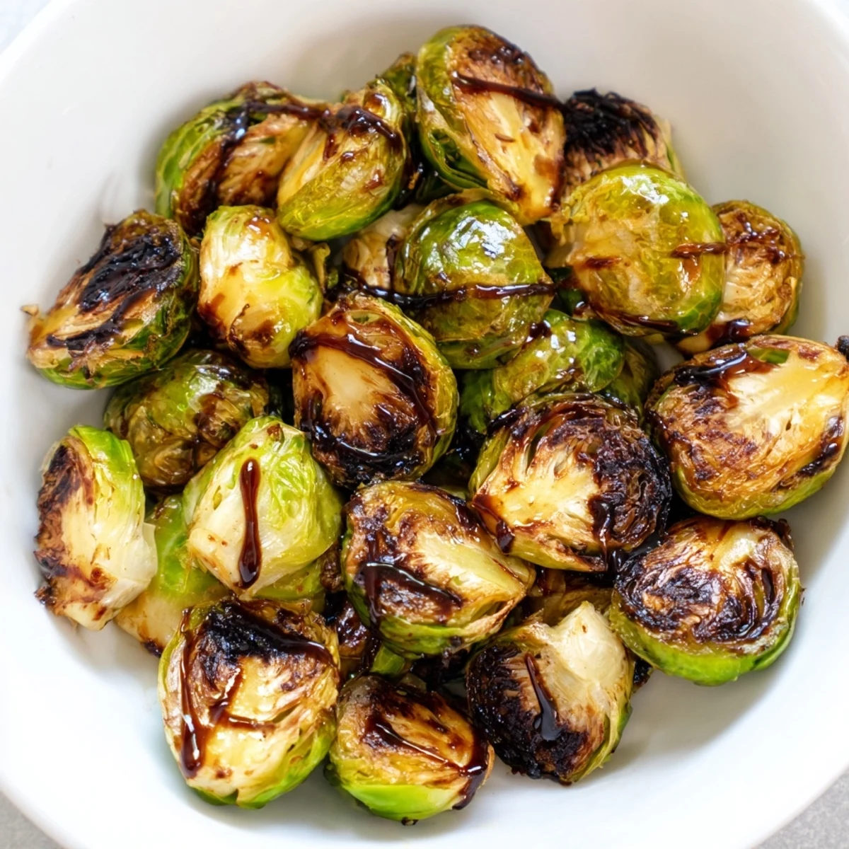 Imagine a plate of beautiful, glistening Roasted Brussels Sprouts; they're perfectly glazed and ready to enjoy.