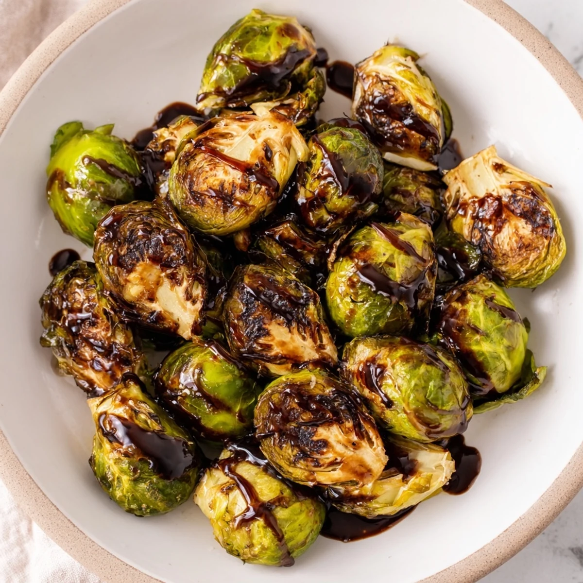 Taste the caramelized edges on these flavorful Roasted Brussels Sprouts, drizzled with tangy balsamic glaze.