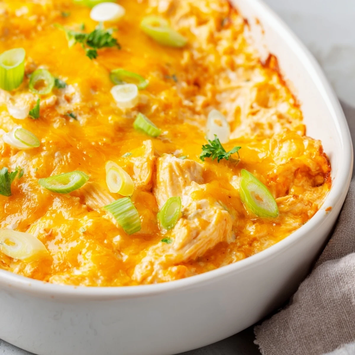 Spicy Buffalo Chicken Dip with Tortilla Chips served on a platter, the perfect game day appetizer surrounded by crunchy chips and celery sticks.