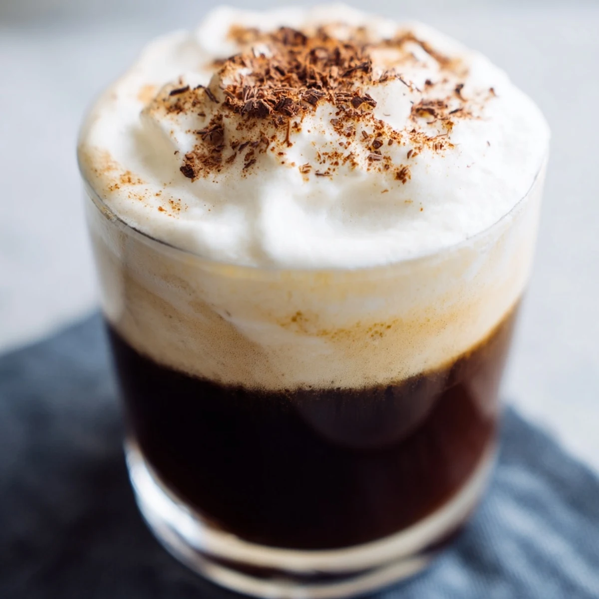 Freshly brewed hot coffee layered with brown sugar and vanilla, served in heatproof glasses for a cozy Irish-inspired treat.  
