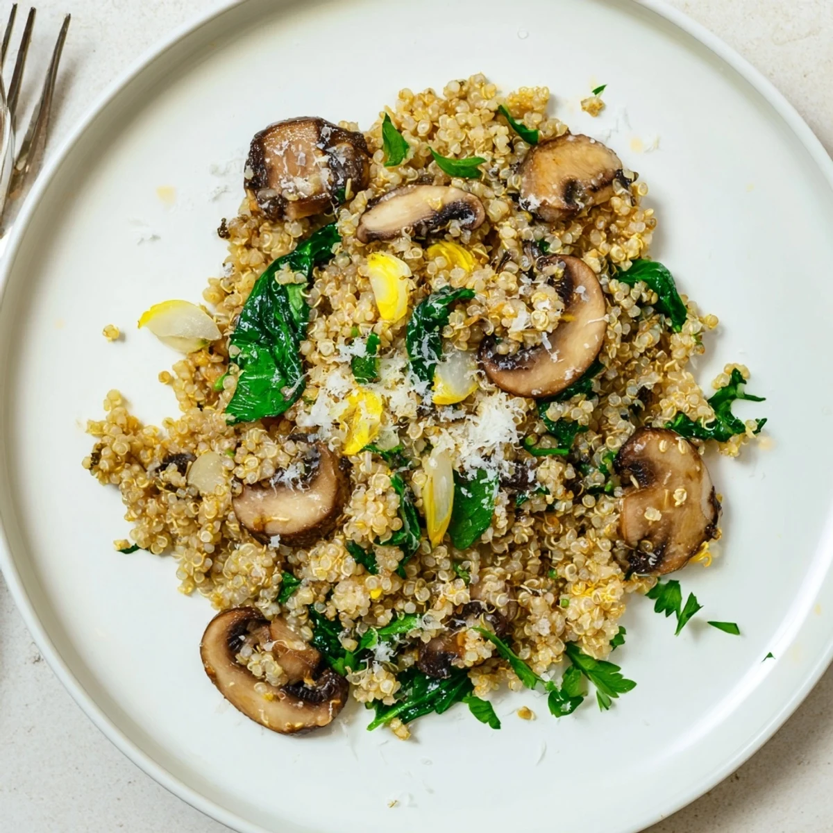 Sautéed cremini mushrooms and fresh garlic swirl over fluffy quinoa in this Garlicky Mushroom Quinoa, finished with a bright lemony aroma.