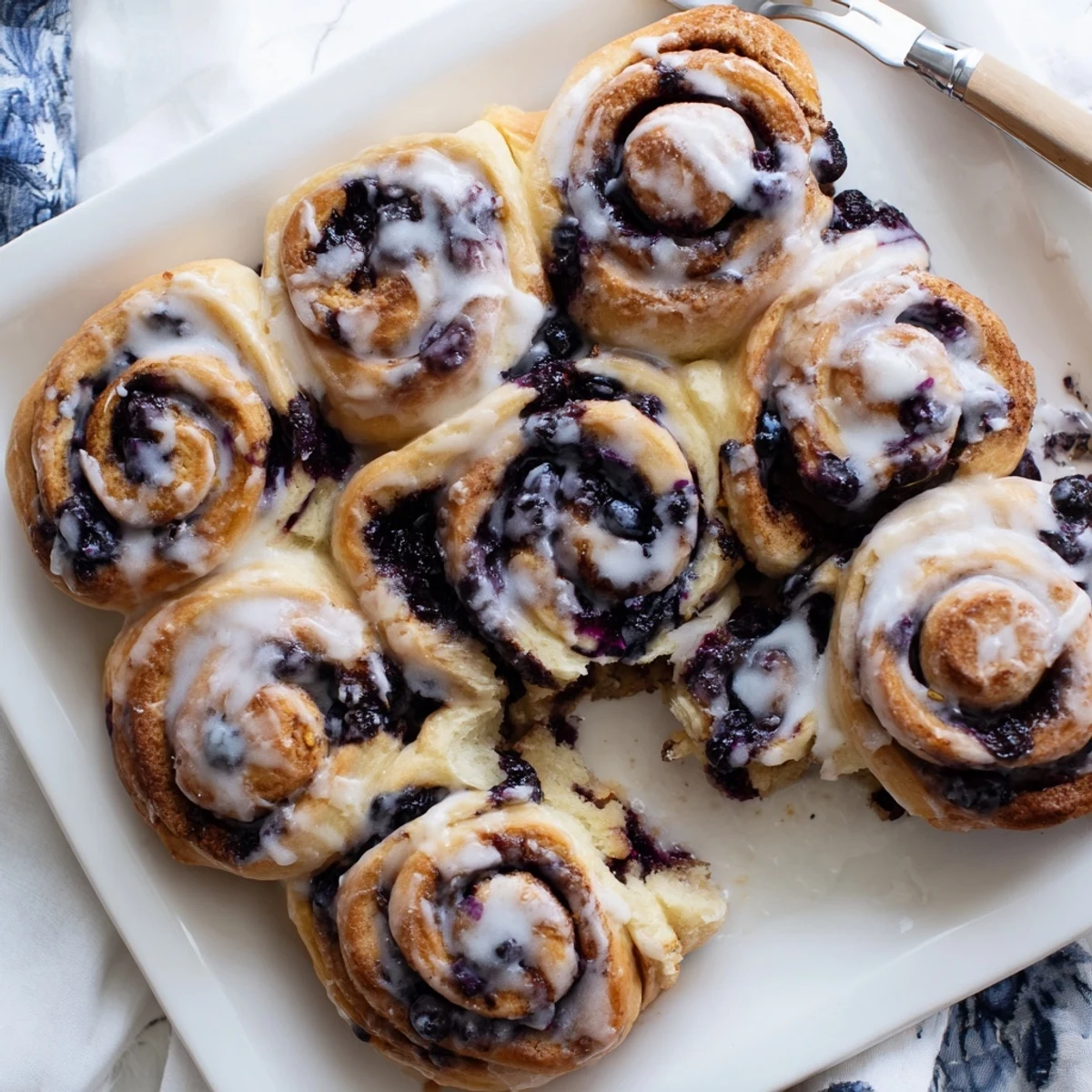 Soft Blueberry Cinnamon Rolls with juicy berries and warm cinnamon sugar.