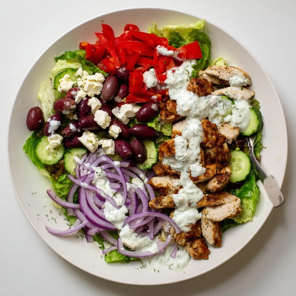 Juicy grilled Tzatziki Chicken Salad topped with dill yogurt dressing, vibrant vegetables, perfect for an easy low-carb main dish.