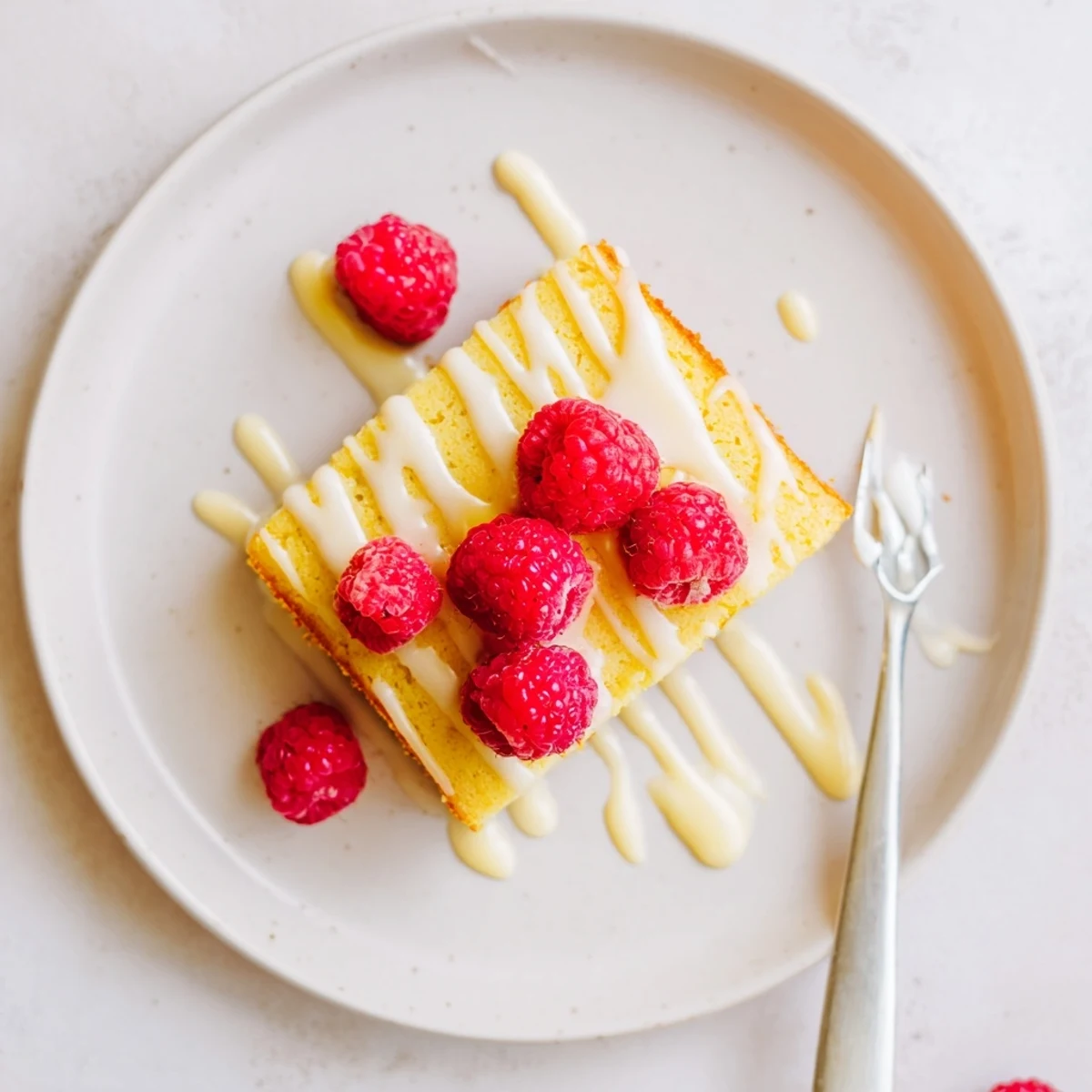 Soft chewy raspberry lemon blondies studded with bright red raspberries and lemon zest