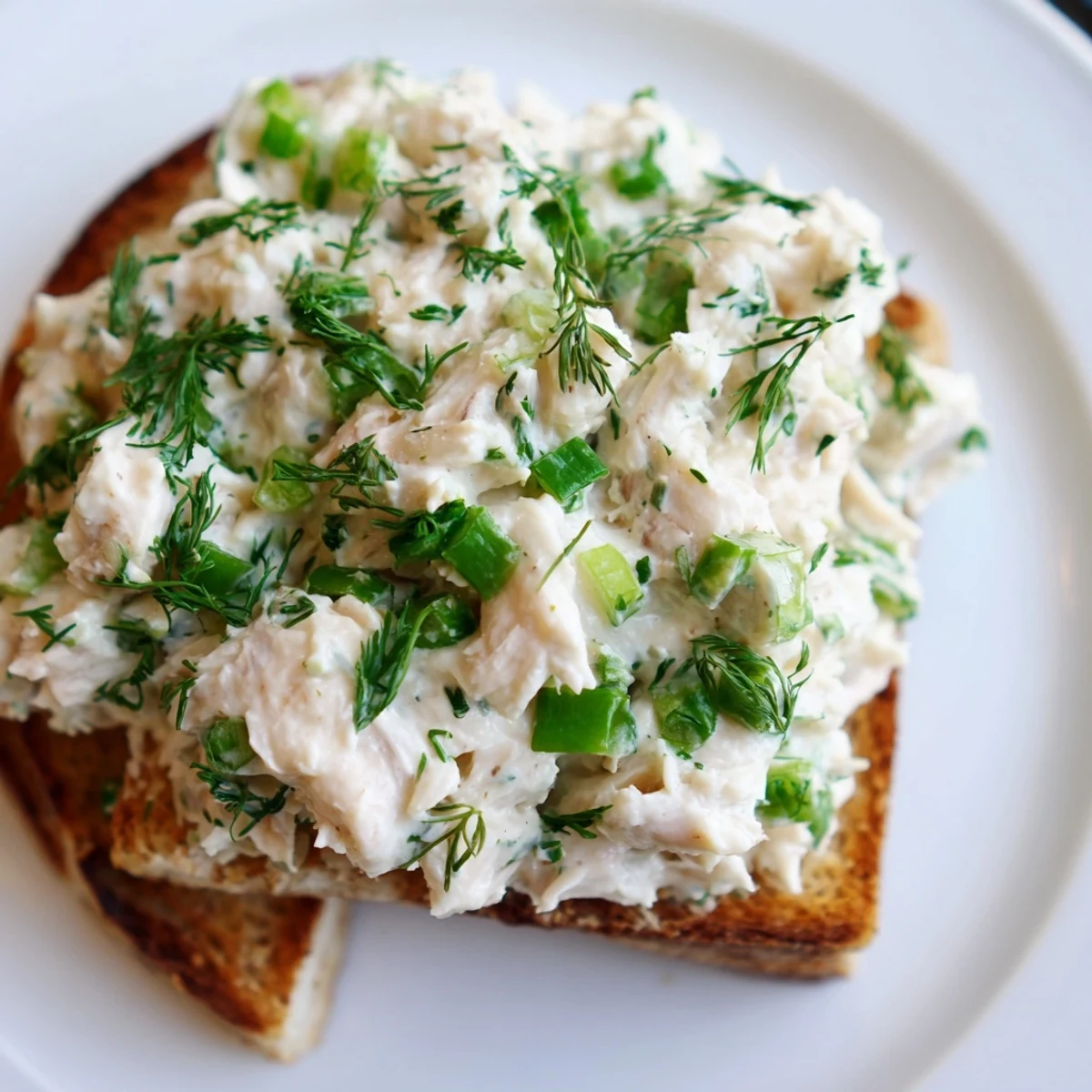 Buttered crisp bread topped with lump crab mixture, chives, and lemon wedges