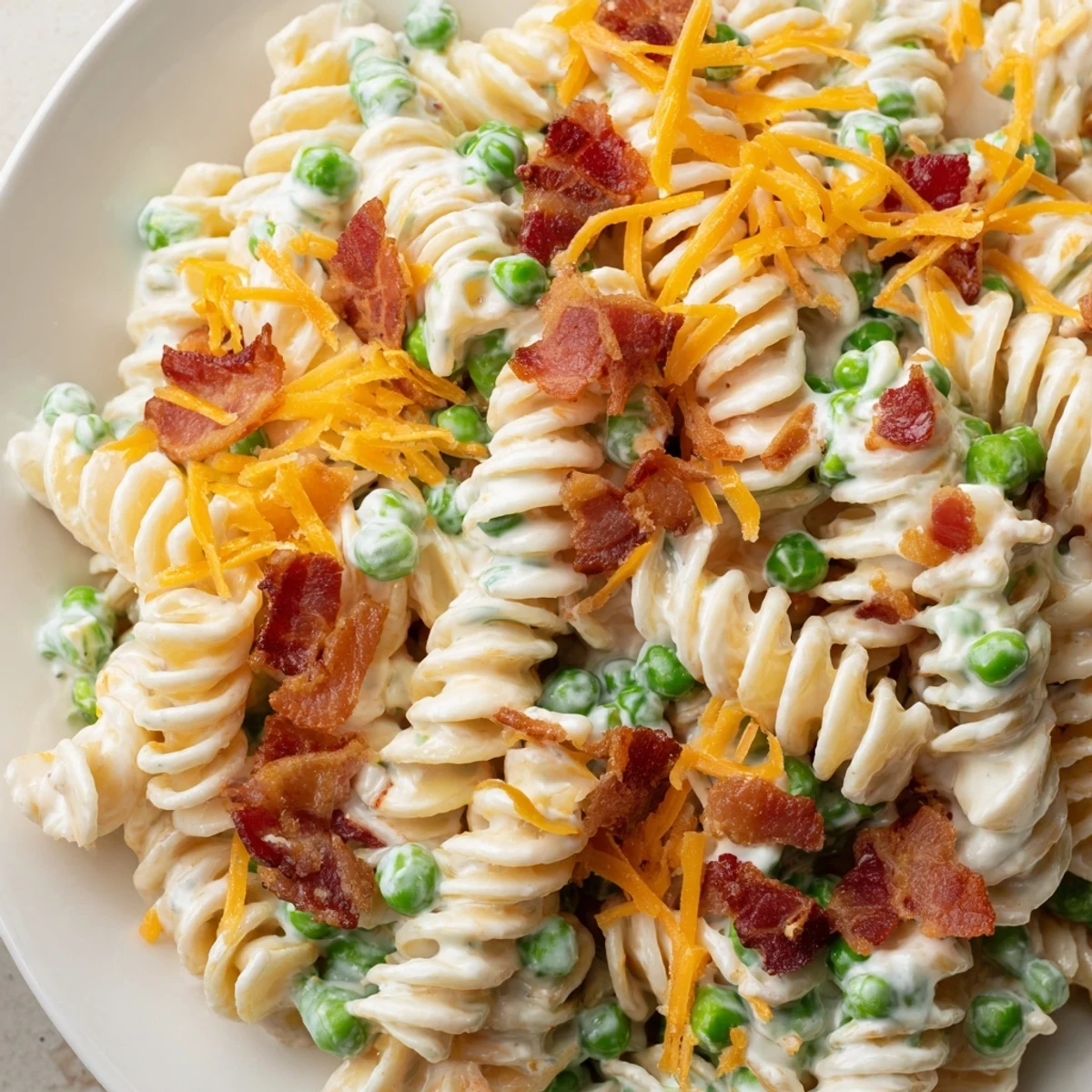 Addictive crack pasta salad featuring rotini, crispy bacon, and sharp cheddar in tangy dressing