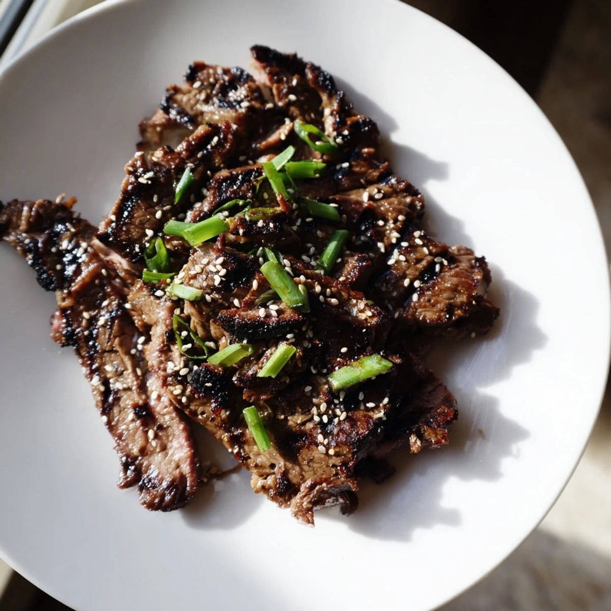 Savory Beef Yakiniku served over fluffy white rice with charred shiitake mushrooms