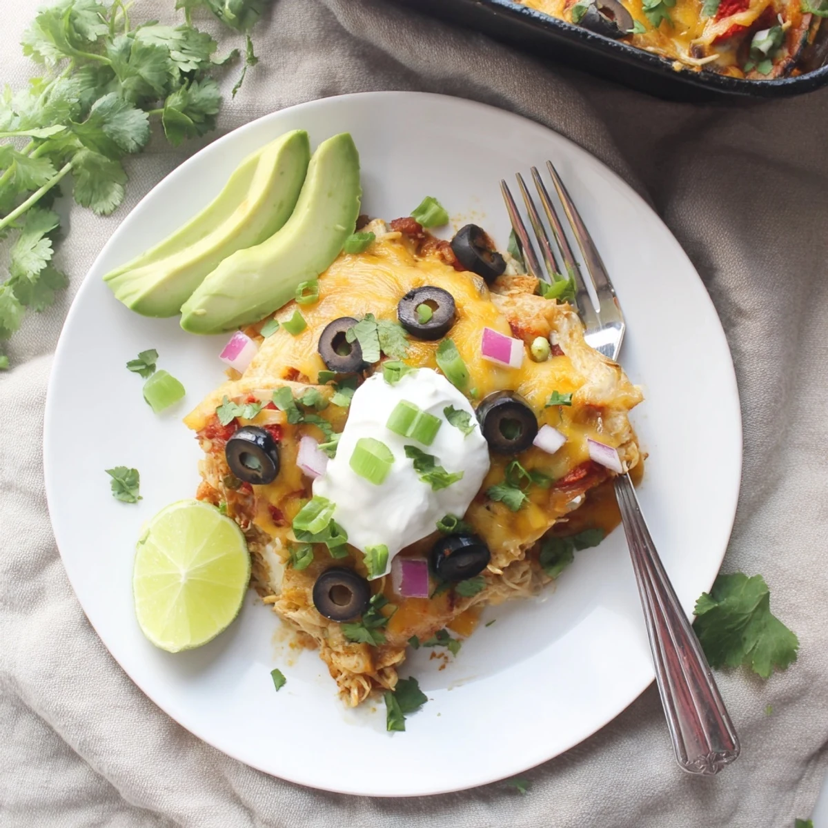 Golden bubbly cheese tops this Cheesy Shredded Chicken Enchilada Bake casserole fresh from the oven