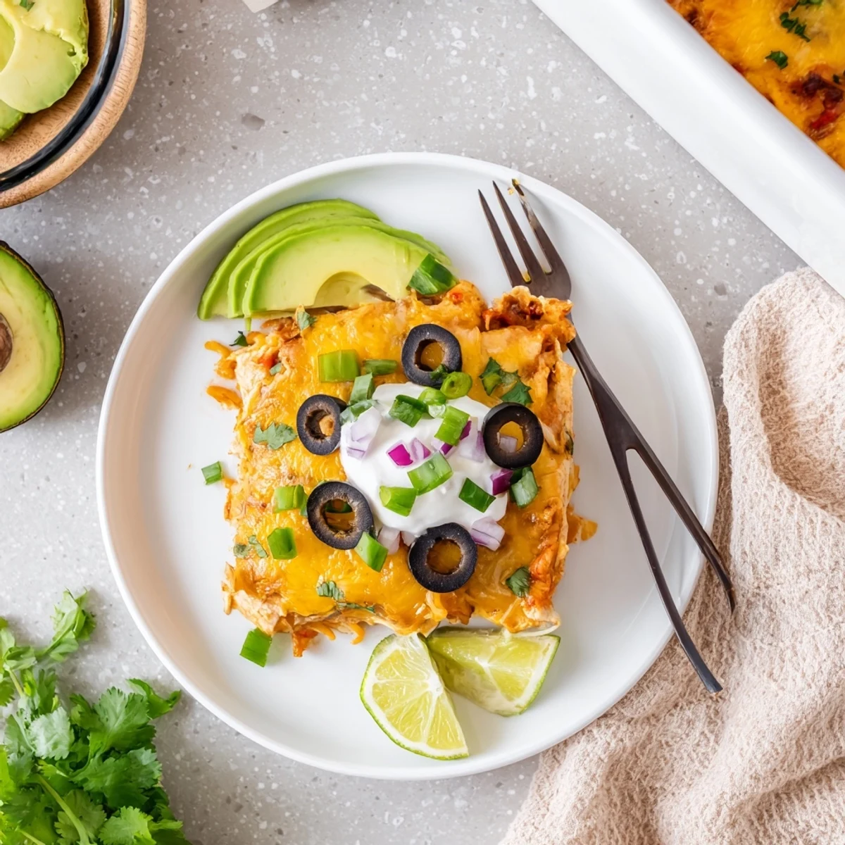 Layers of tender chicken and melted cheese in this comforting Cheesy Shredded Chicken Enchilada Bake