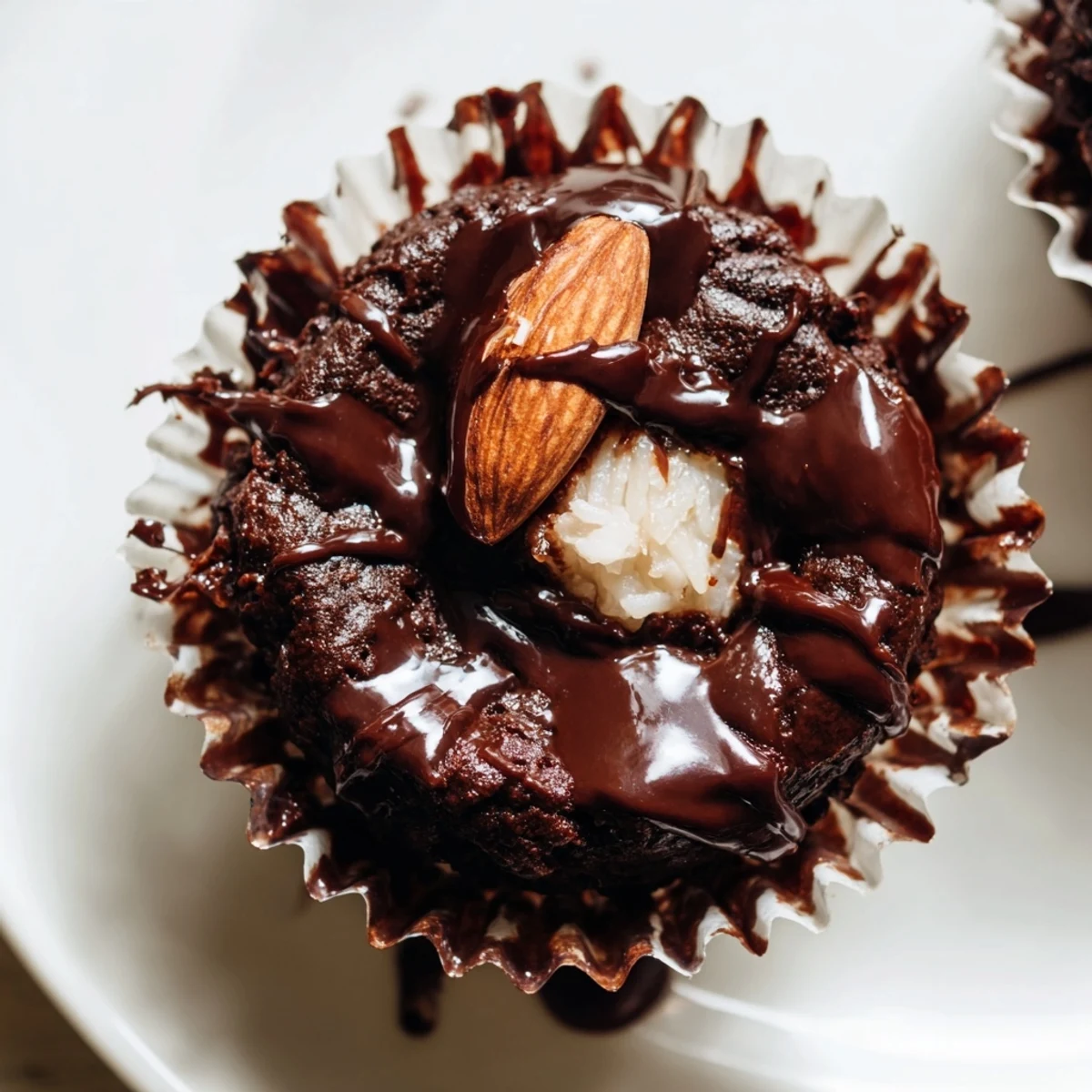 Decadent flourless almond joy cupcakes with gooey coconut centers fresh from the oven