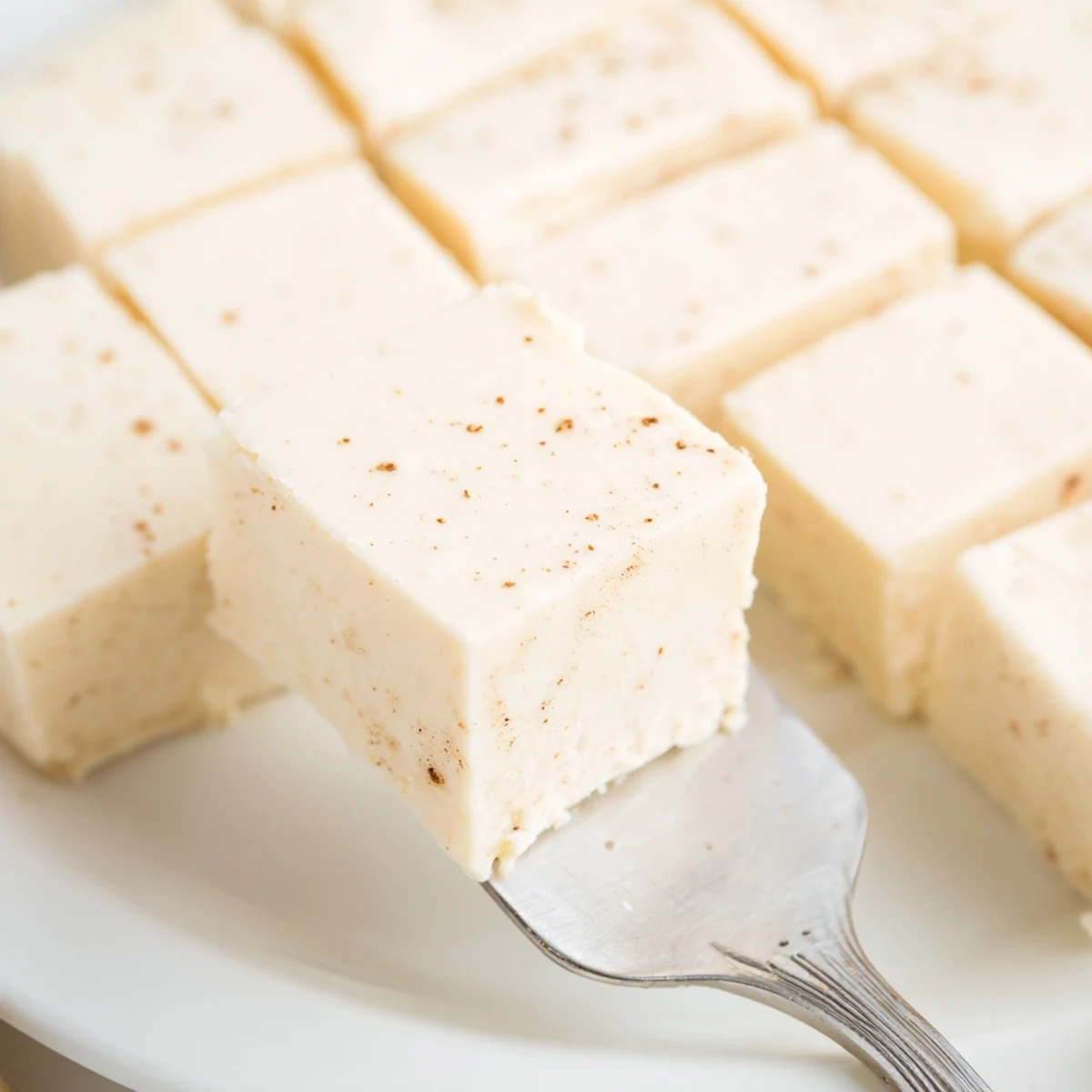 Rich Eggnog Fudge cut into bite-sized pieces, chilled and ready to serve