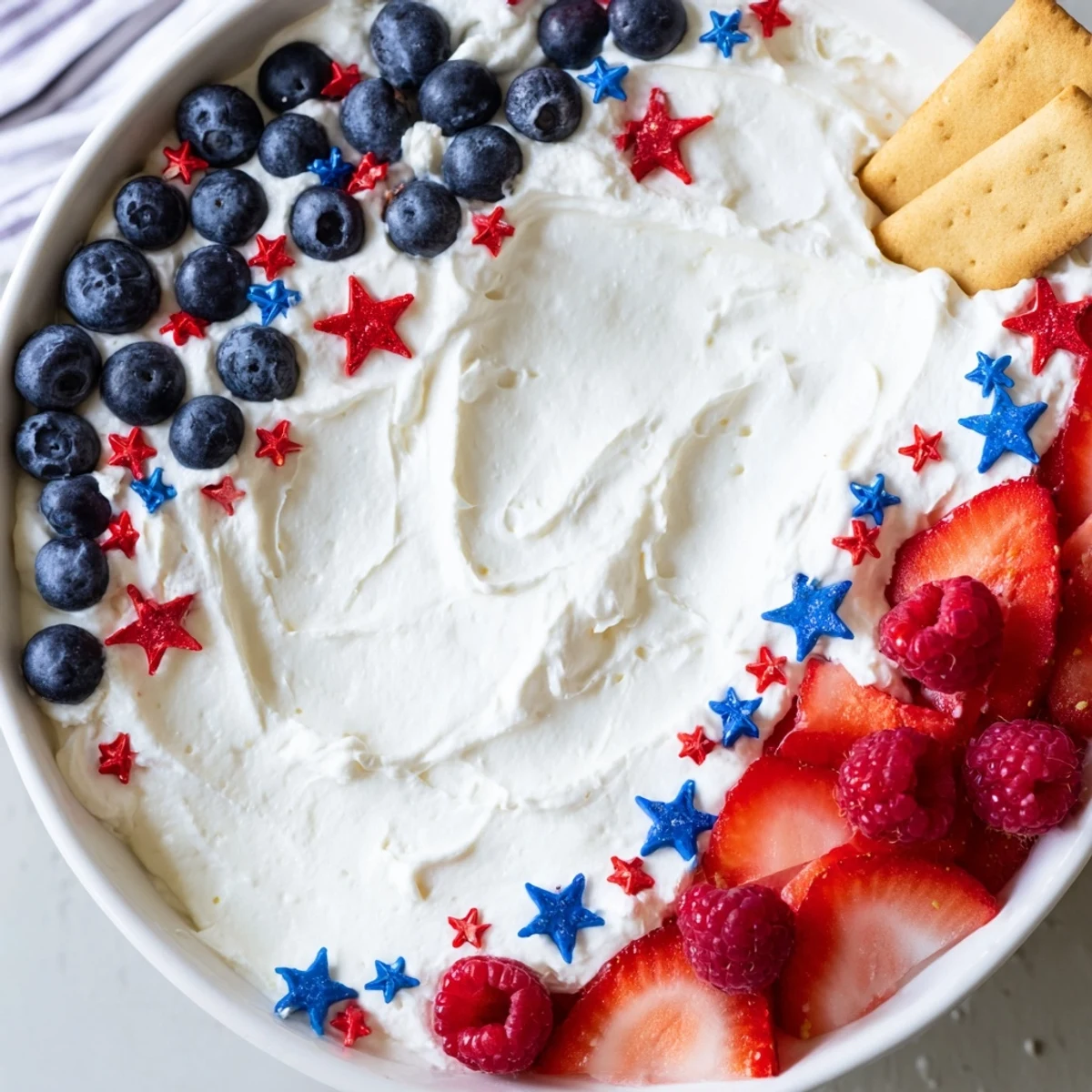 Light, whipped texture of How To Make Star Spangled Cheesecake Dip chilled for serving