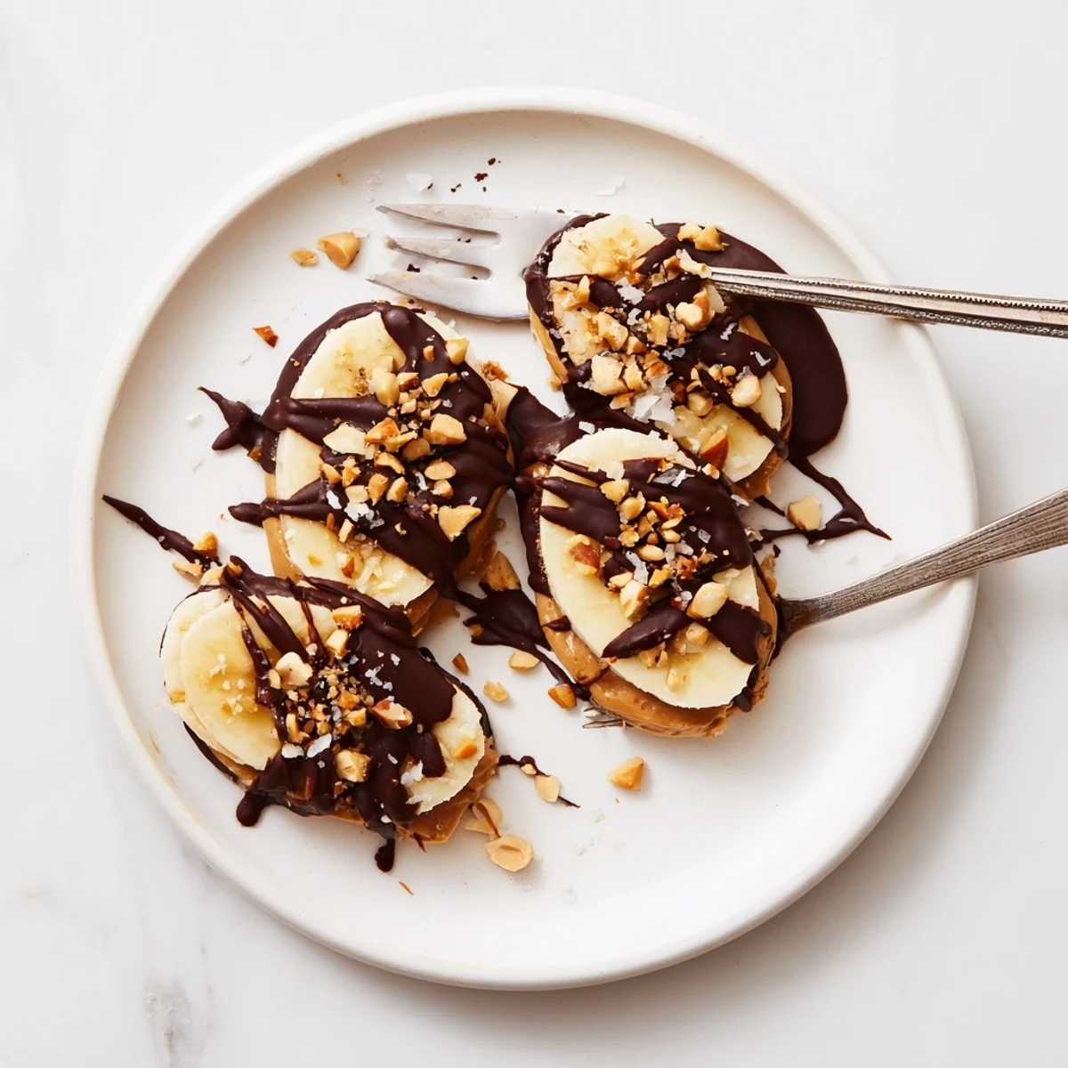 Silky drizzle over parchment showcases Chocolate Peanut Butter Banana rounds, ready to share