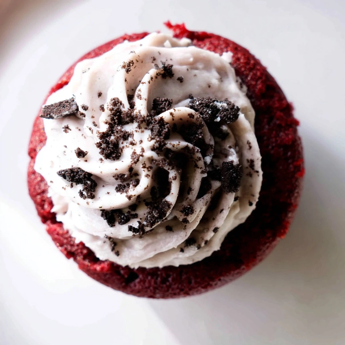 Decadent Red Velvet Oreo Cupcakes piled high with fluffy cookies and cream frosting