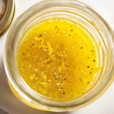 Tangy citrus vinaigrette whisked to a silky emulsion with flecks of zest